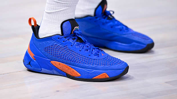 View of blue and orange Jordan Luka shoes.